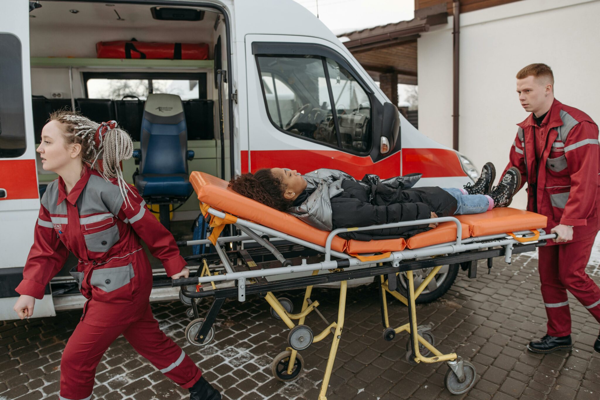 Woman being transported to an ambulance after an aviation accident.