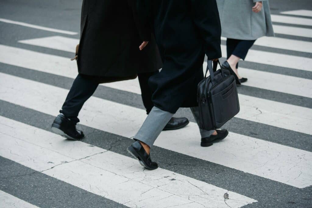 Pedestrian walking through a crosswalk.