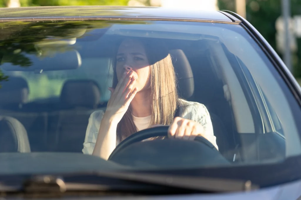 A driver who looks in the rearview mirror while fleeing an accident.