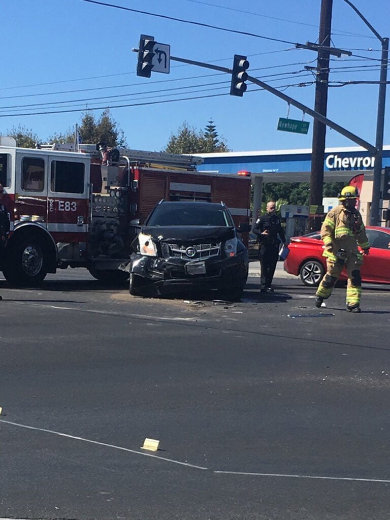 Scene of the intersection crash with the presence of the defendant's car and the fire truck.