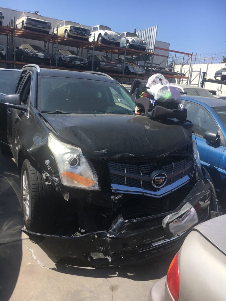Severe damage to the front of the defendant's car.