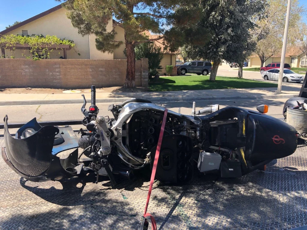 A motorcycle rear ended the victim's car violently.