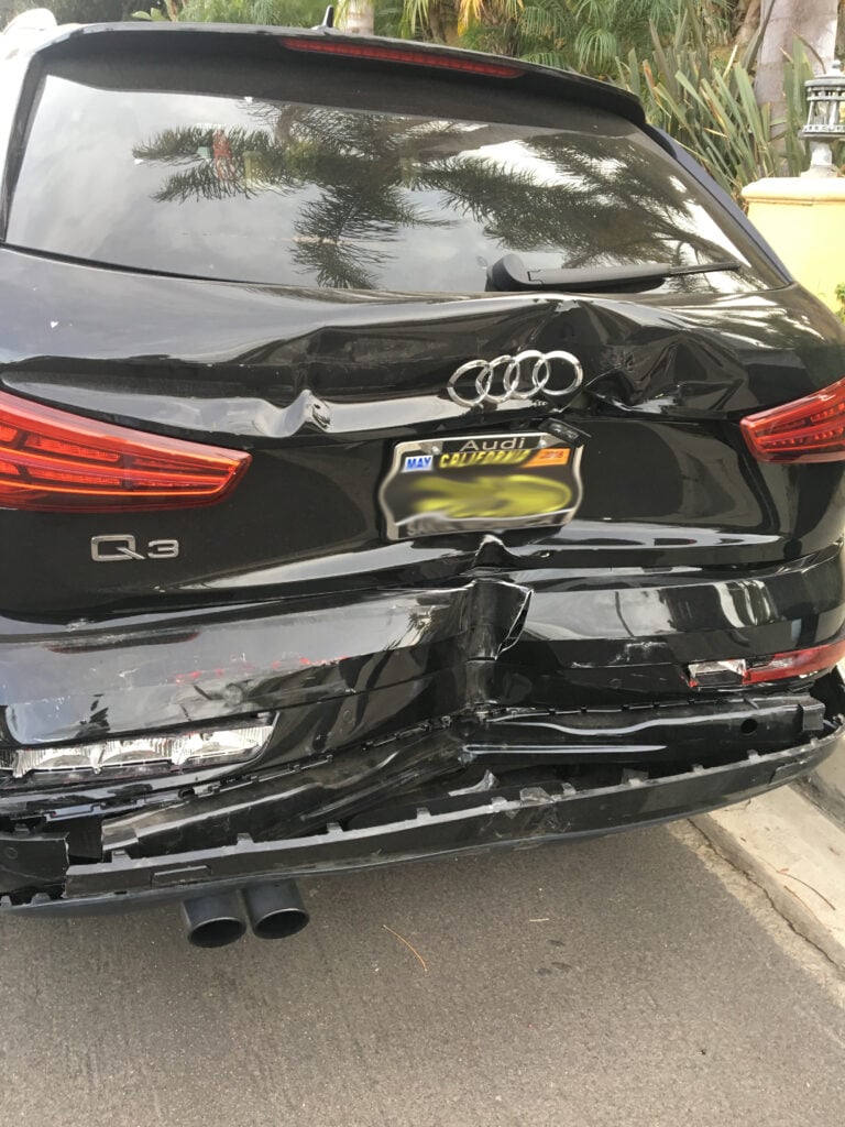 The victim's car was totaled in the rear end accident.