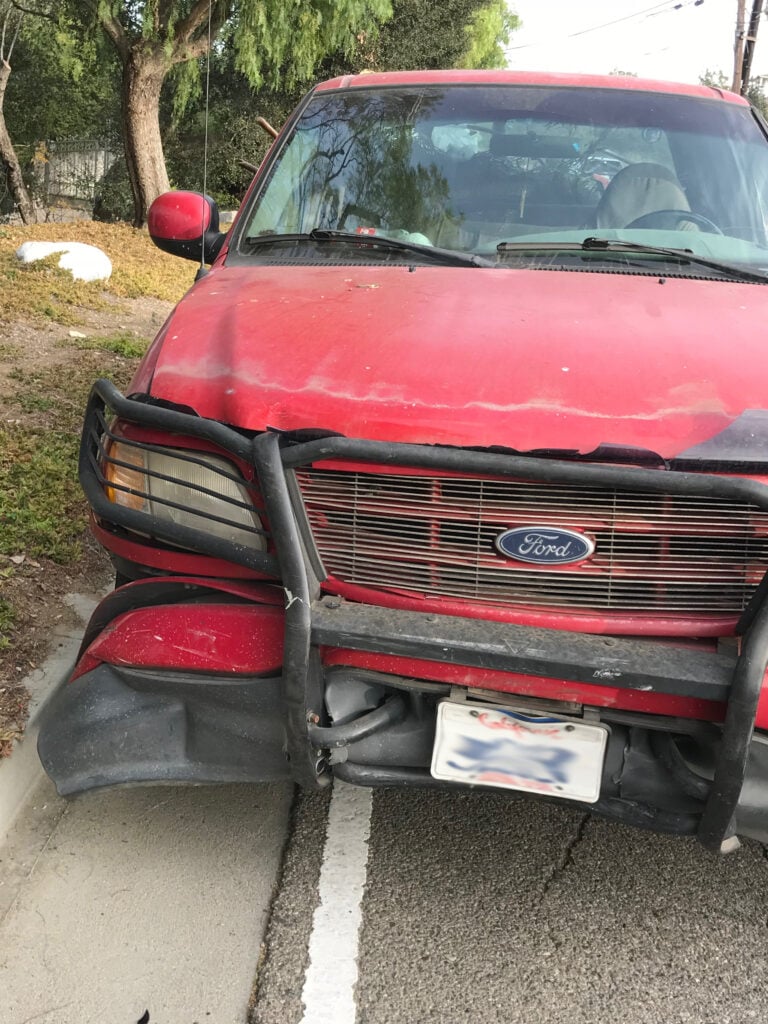 The defendant's car sustained front-end damage.