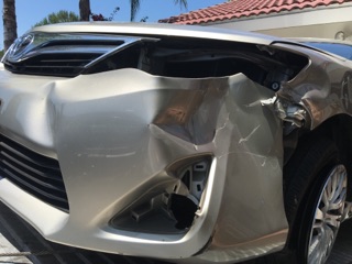 The victim's vehicle sustained significant damage to the side and front of the vehicle.