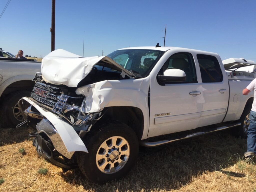The defendant blew out the front end of his car in the collision.