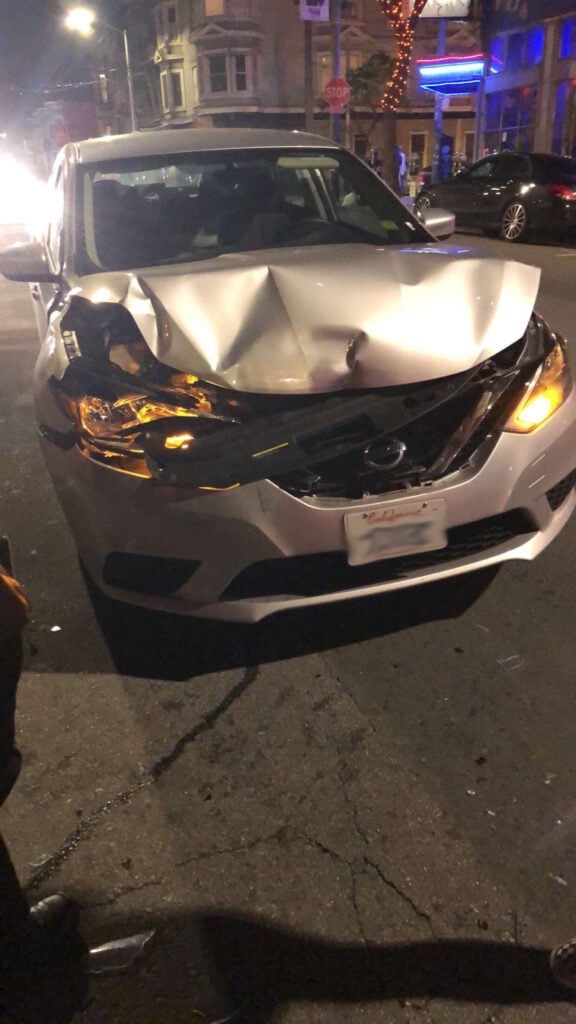 The front of the defendant's car was also damaged.