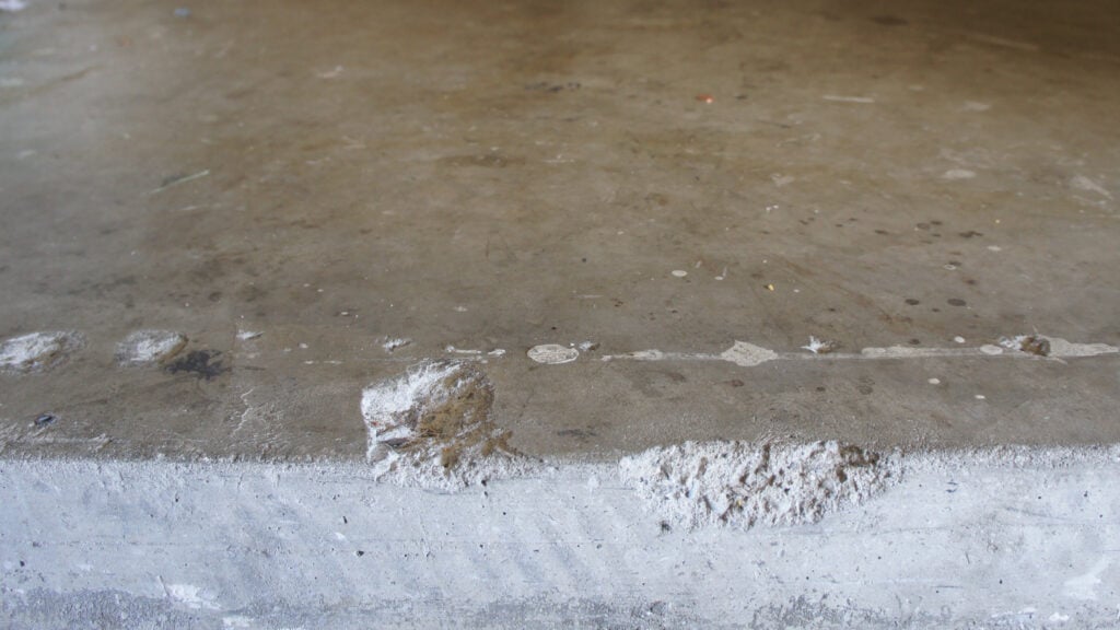 Broken concrete caused the slip and fall.