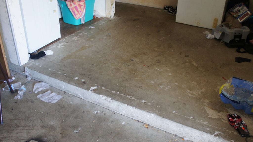 Garage with the broken concrete step where the slip and fall occurred.