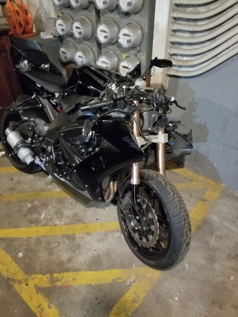 The victim's motorcycle was badly damaged after the accident with the pickup truck.