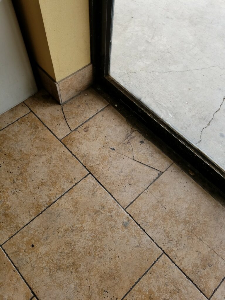 The broken tile in a California yogurt store caused the victim to trip and fall, resulting in shoulder, back and neck injuries.