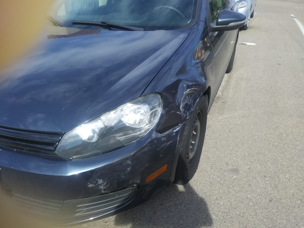 The accused driver who caused the T-bone accident also suffered serious damage to their car.