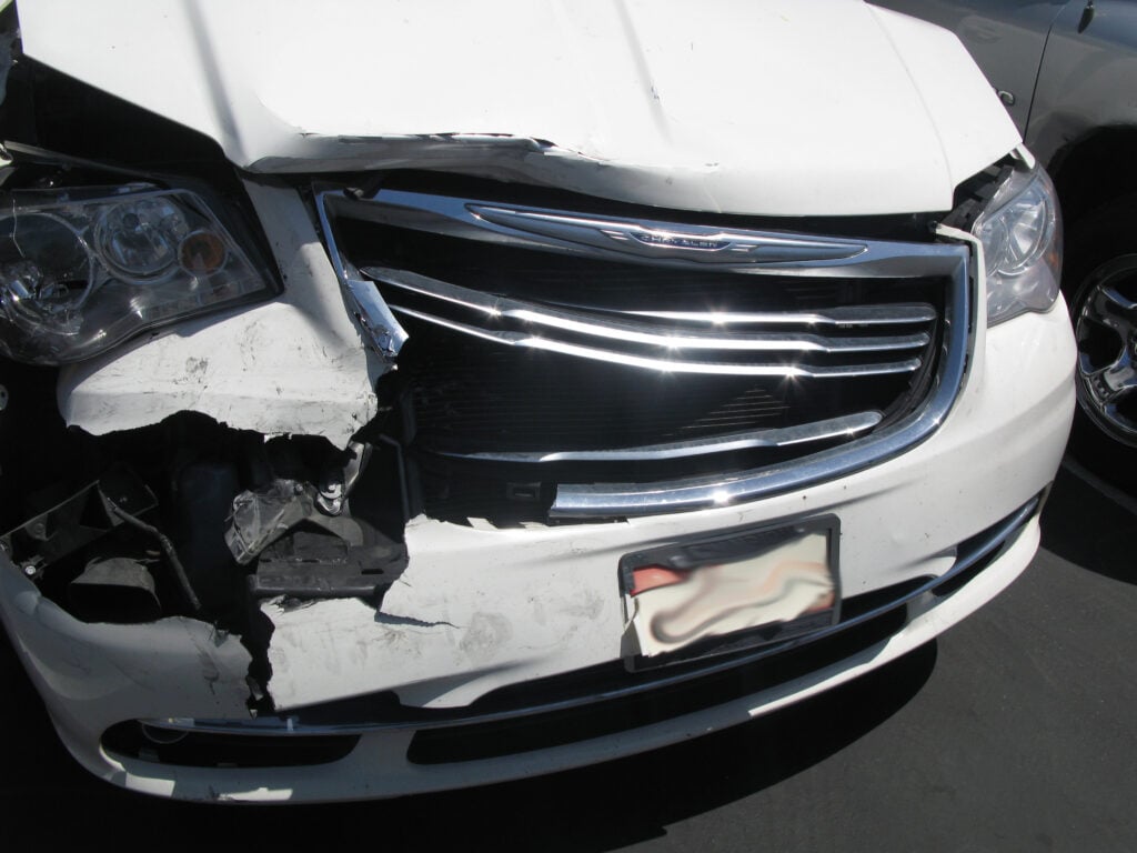 The victims' car, which was heavily rear-ended, collided with the vehicle in front of it.