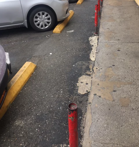 The wheel stop caused the fall accident in a Santa Ana parking lot.