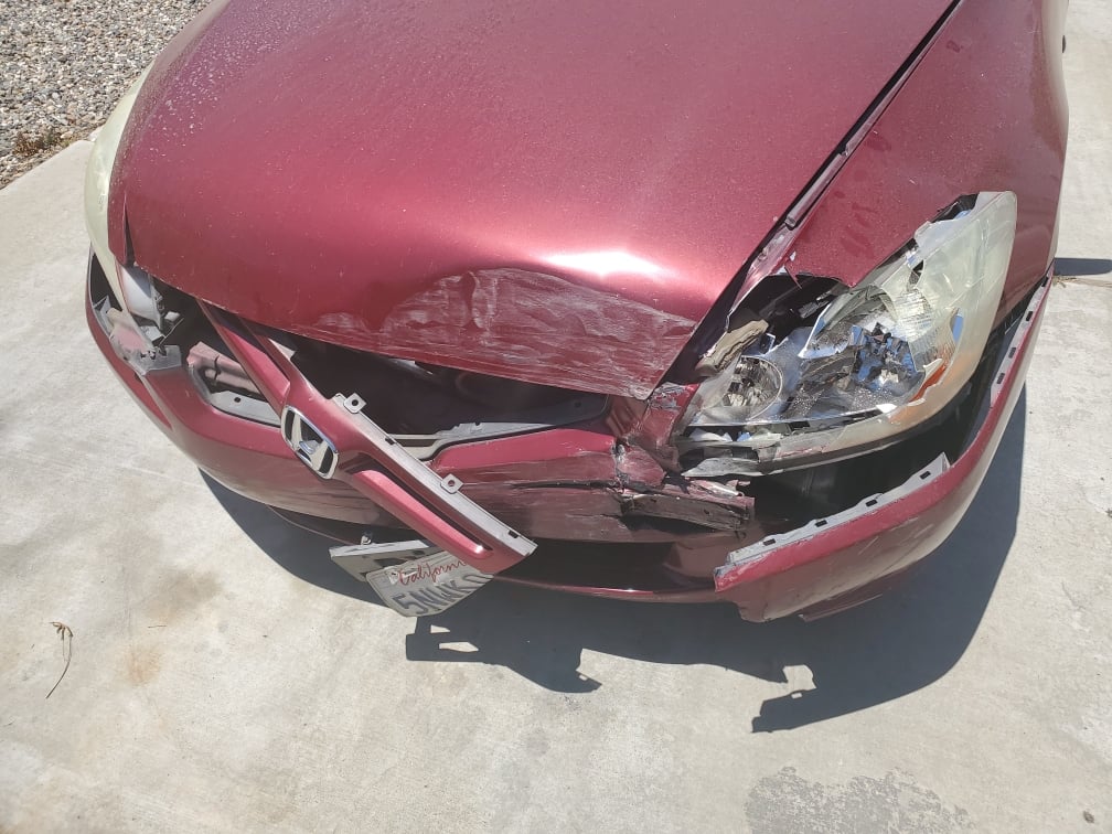 The front bumper of the victim's car was partially detached.