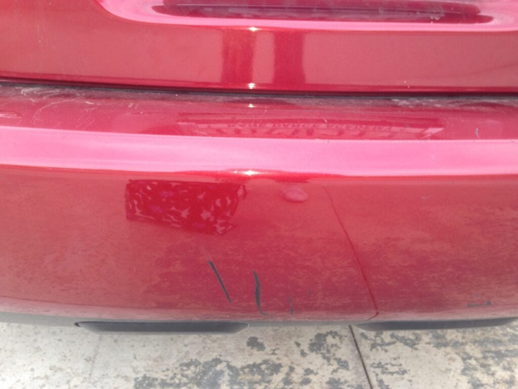 Scratches on the back of the plaintiff's car.