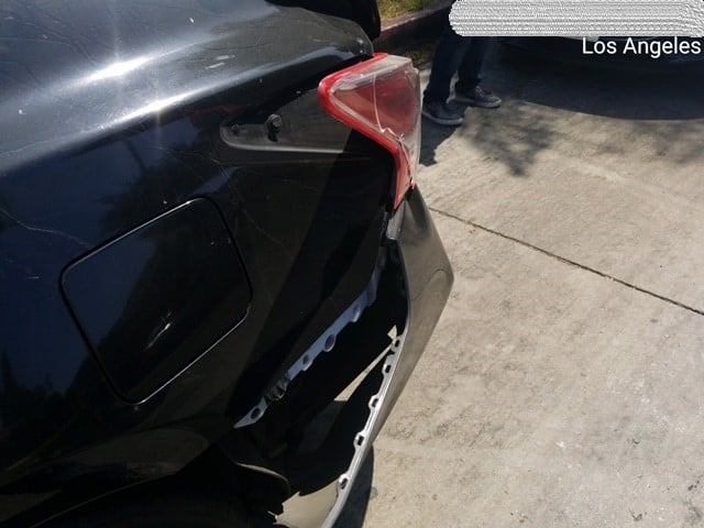 Rear side of the victim's car after being hit.