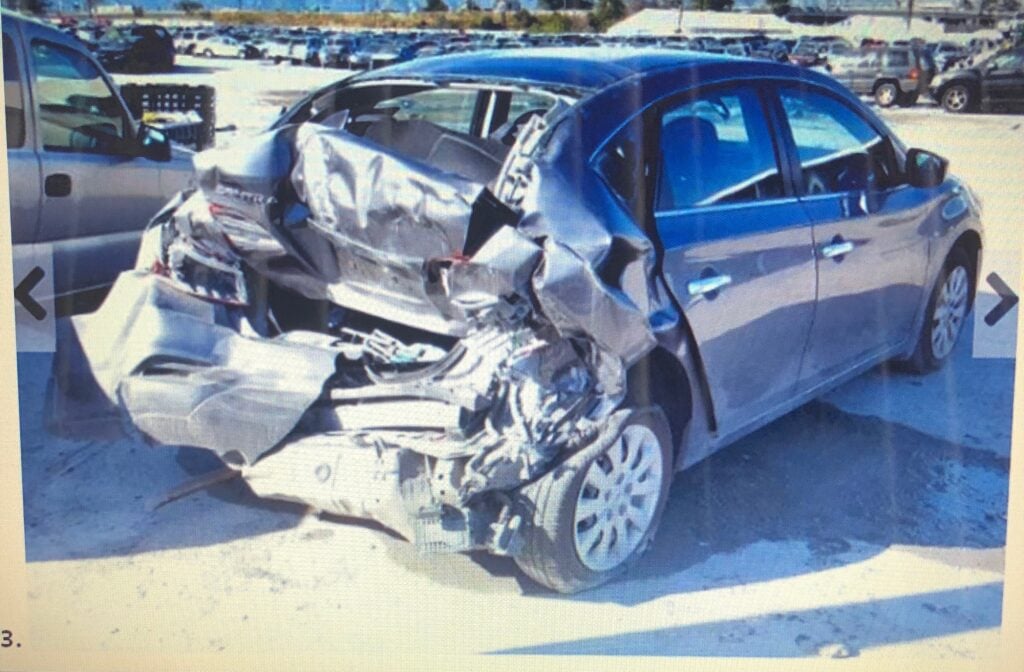 Car destroyed after a rear-end collision.