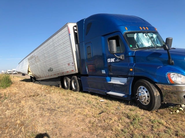The victim's Freightliner truck on the side of the roadway in Texas.