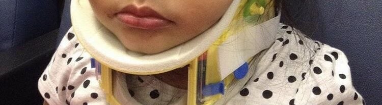 Young girl with a neck injury sustained in a car accident.