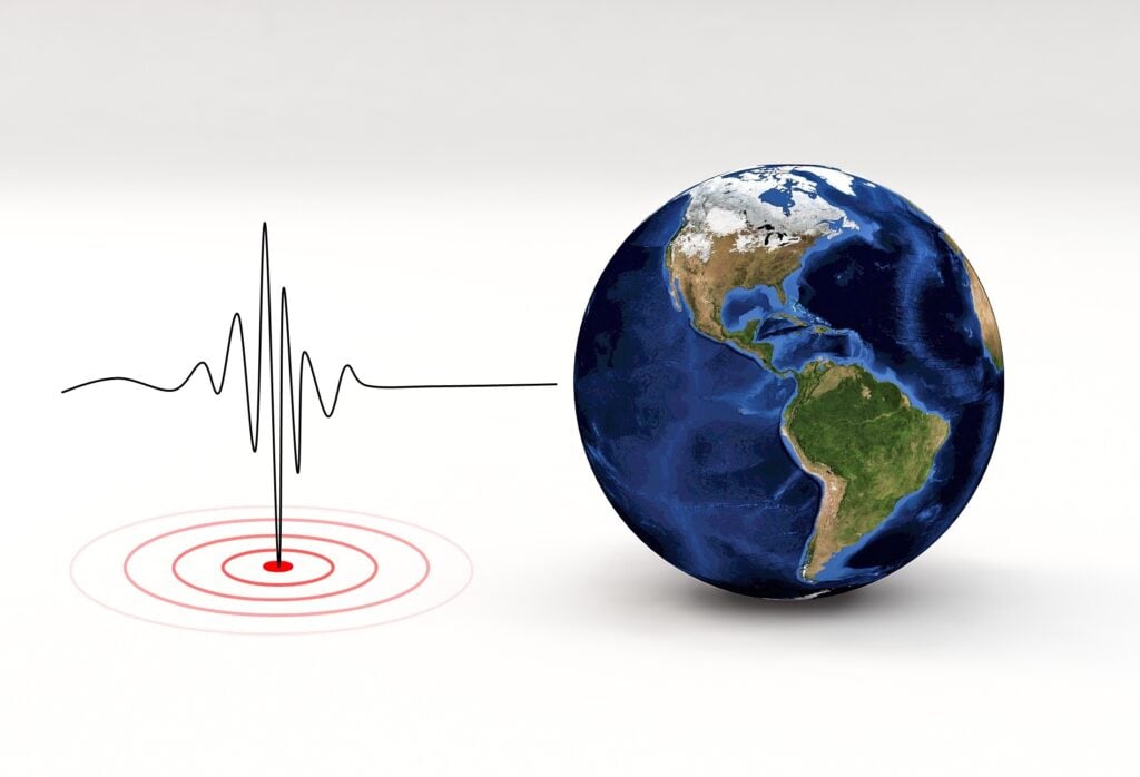 Earth map and a seismometer.