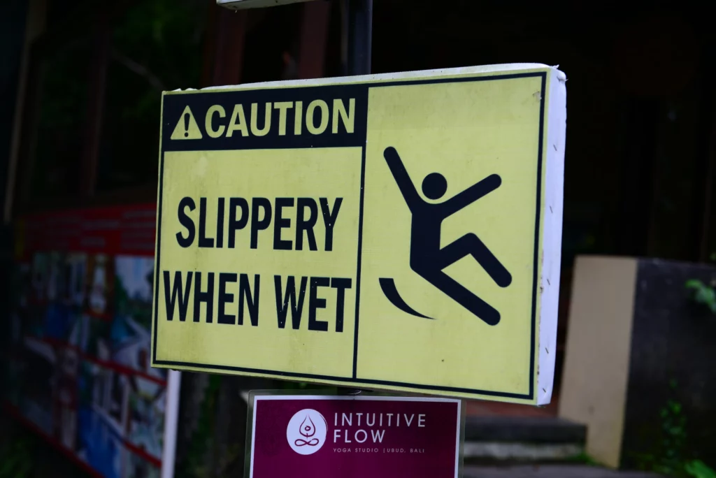 slippery when wet caution sign”