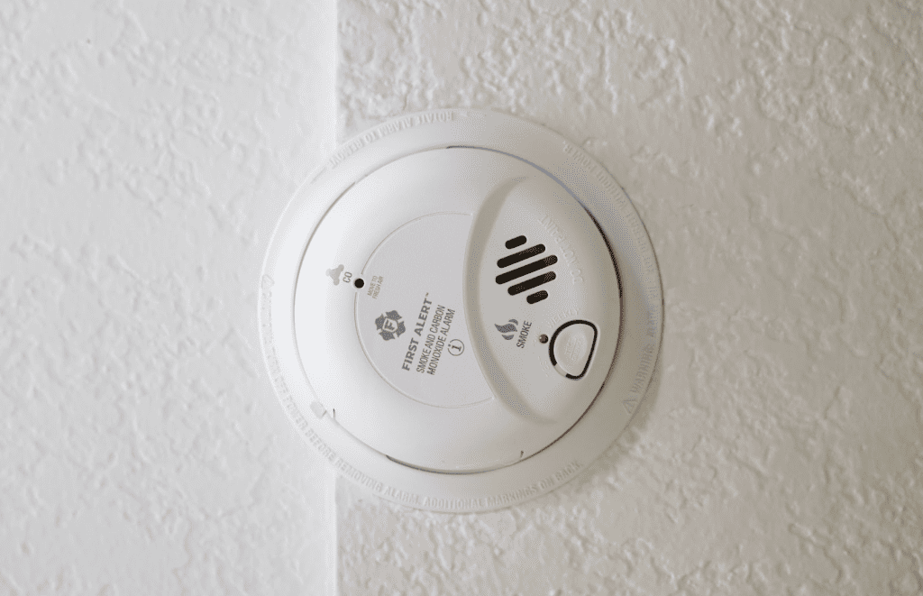 a carbon dioxide detector mounted on a white wall