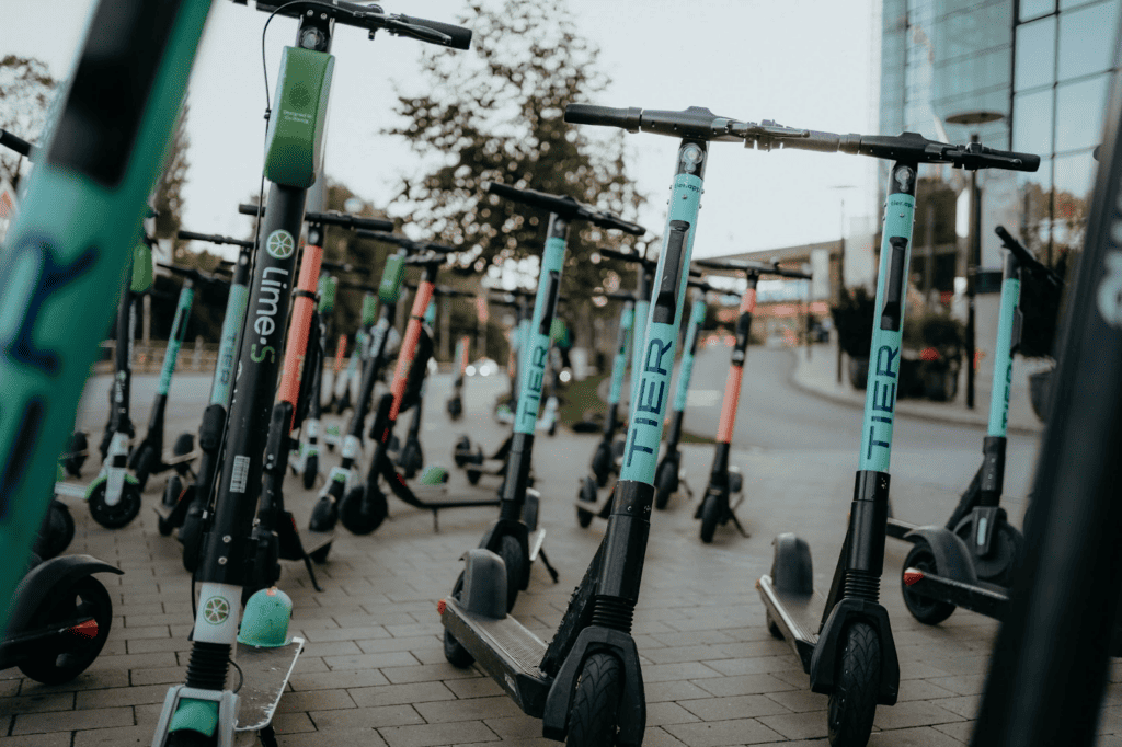 electric scooters parked on the side of the road