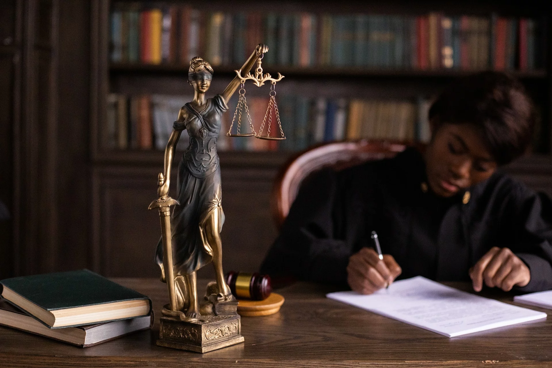 A judge signing papers