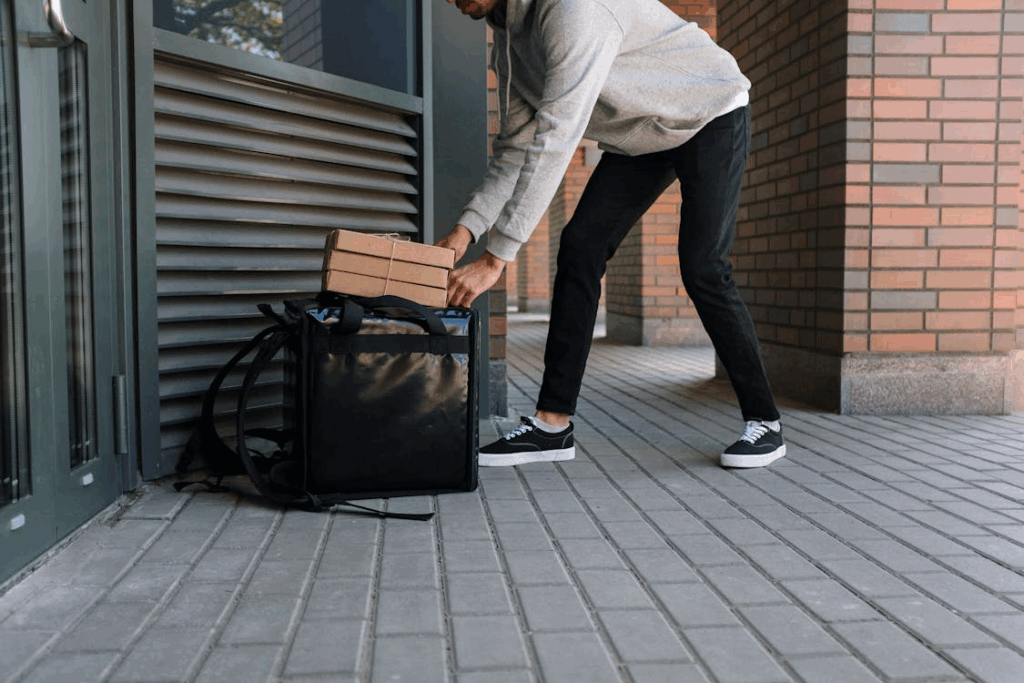 A food delivery worker preparing an order.
