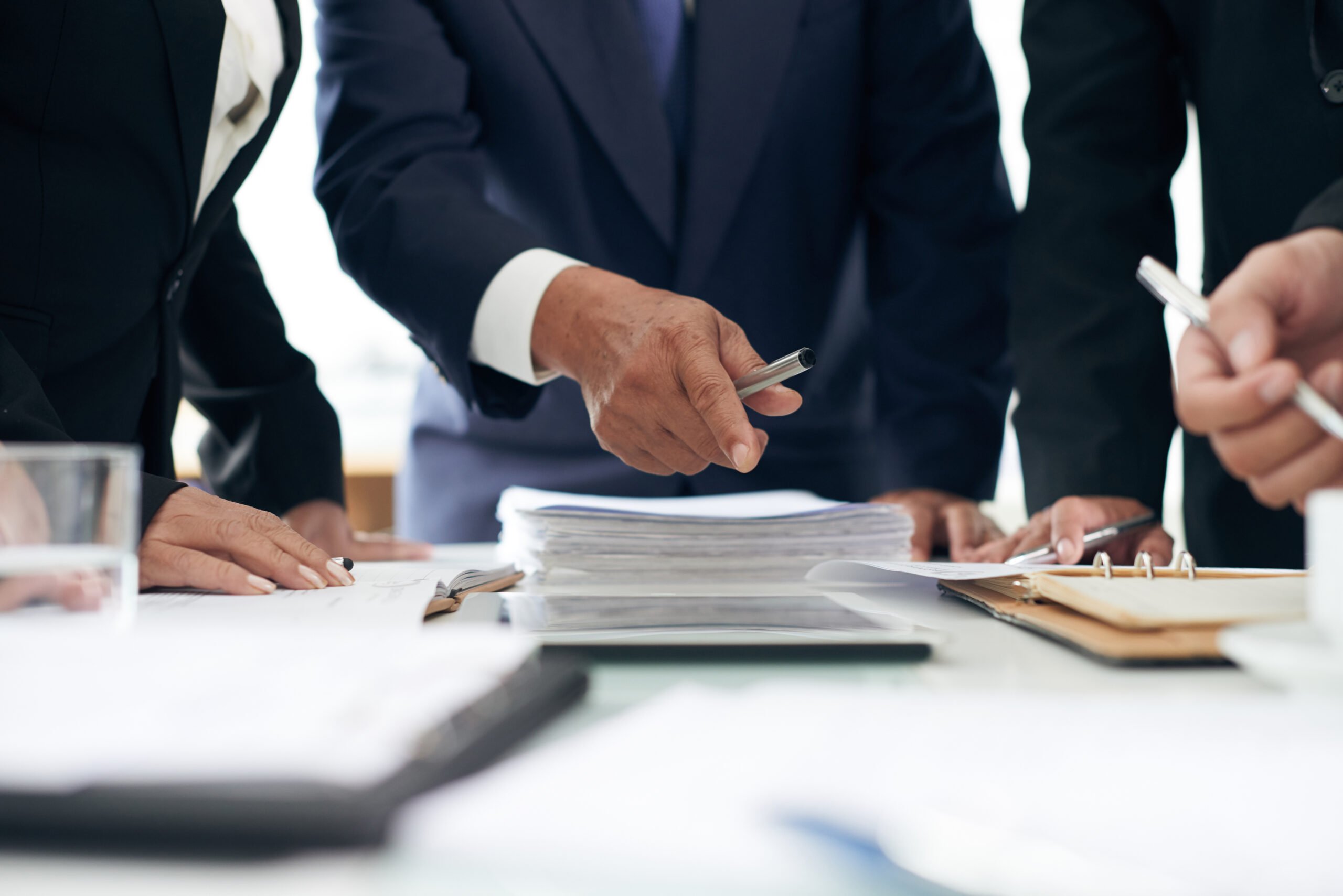 Lawyer showing evidence he found in papers to coworker