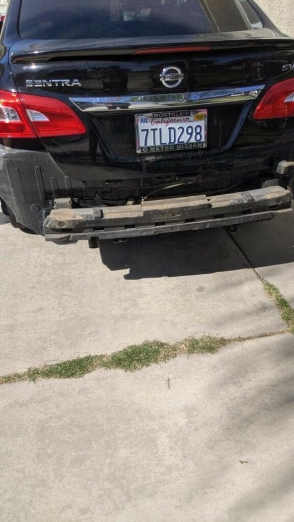 Rear of plaintiff's car after the accident on a Colton street.