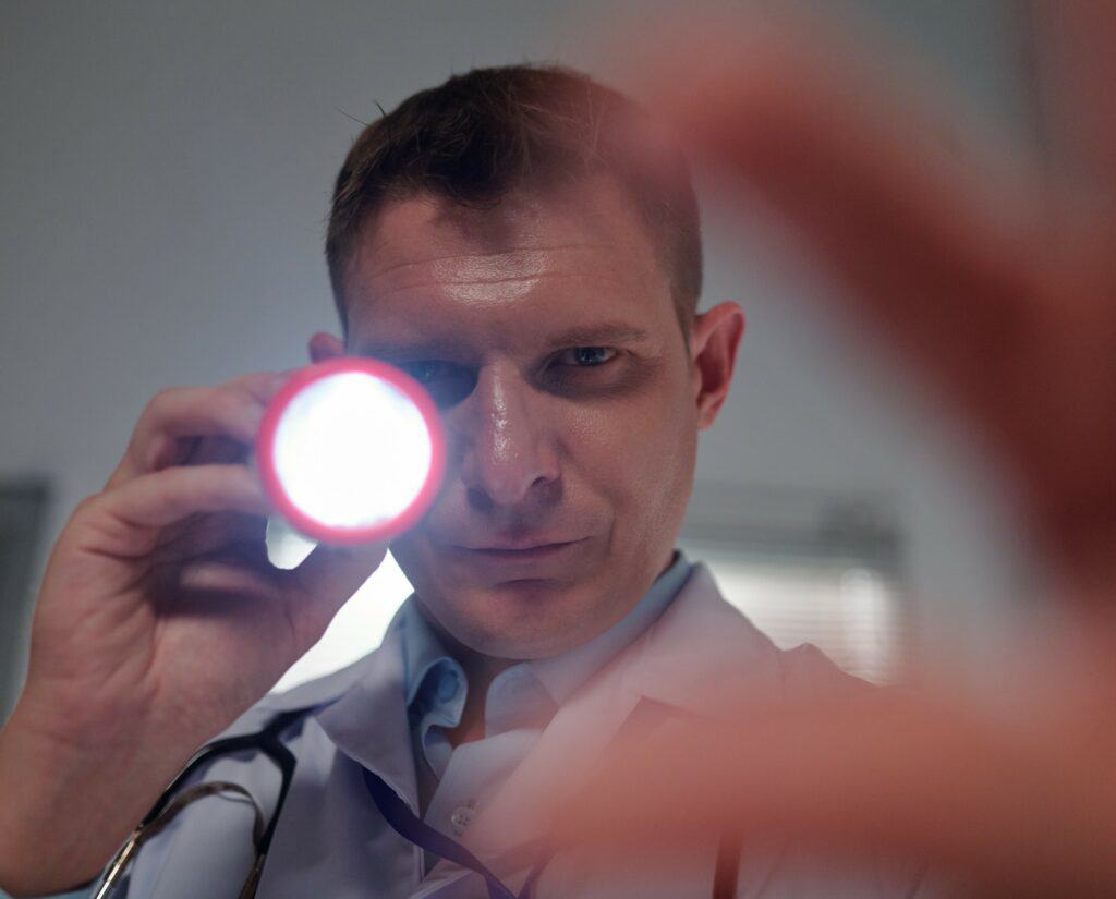Doctor examining a concussion patient during one of the stages of recovery.