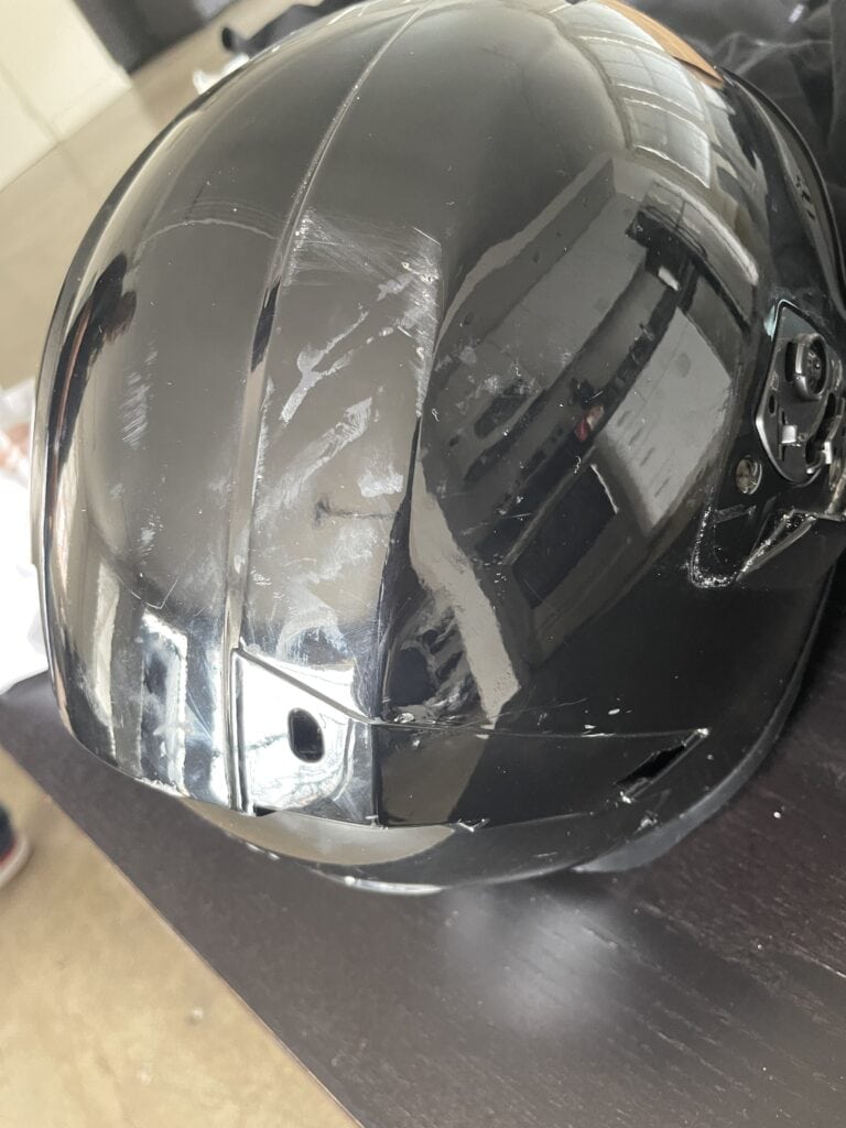 Helmet damaged by the motorcycle accident.