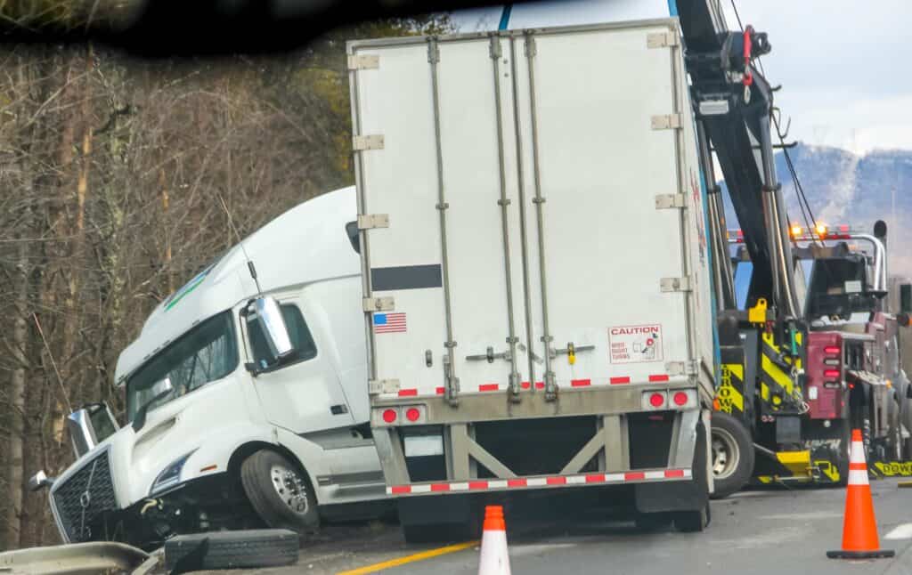 Truck on the side of the road after an accident.