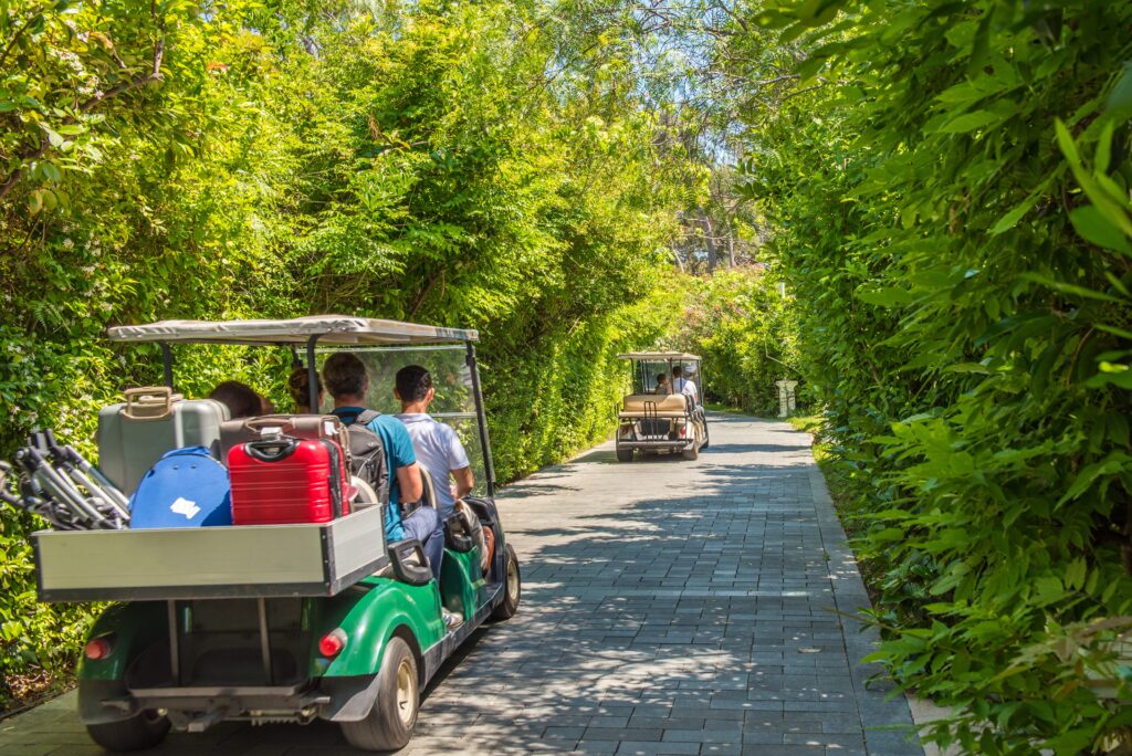 Golf carts used to transport luggage and guests.