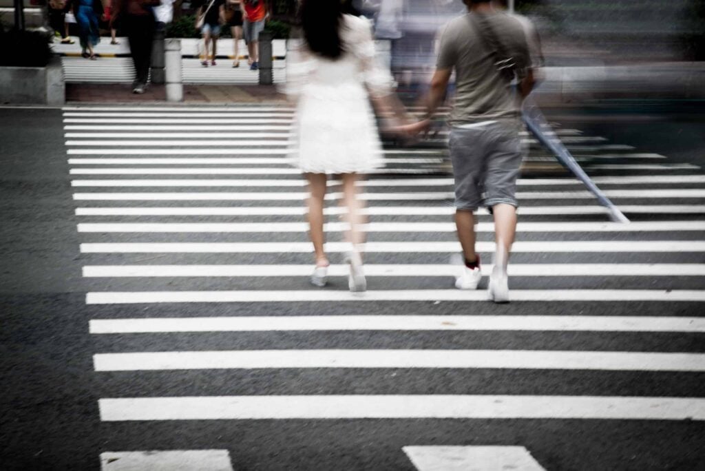 Pedestrians crossing a crosswalk.