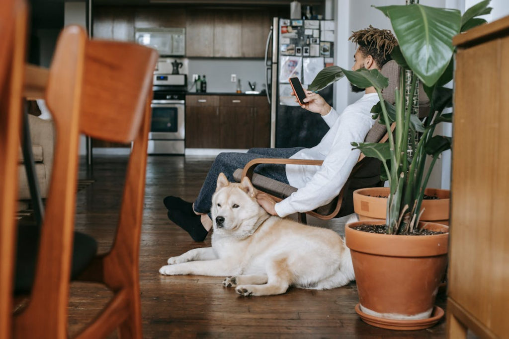 Tenant sitting next to his dog.
