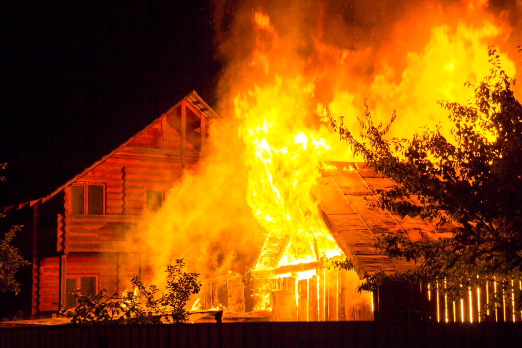 California wildfire burning a residential home causing property damage